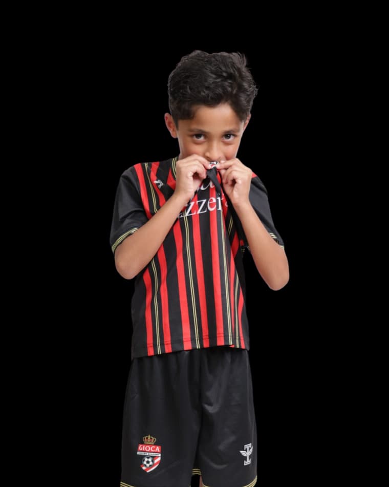A young Gioca player in the team kit