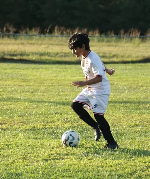 A young player scanning the field during play