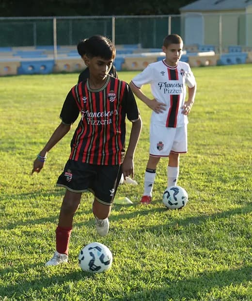 Young soccer players practicing together on the field